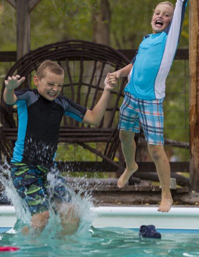 Boys Swimming in Pool - Lazy L&B Dude Ranch Wyoming